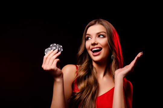 Portrait of happy rich stunning lady hold poker chips win monwy empty space on black color background