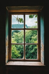 Window with a view of trees and mountains