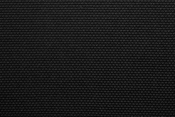 Obraz premium Detailed close-up of a black woven grid pattern, bold and structured texture of guitar amp fabric.