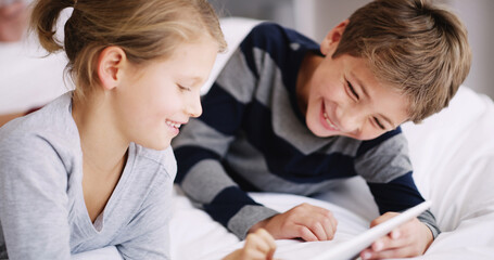 Obraz premium Tablet, relax and kids on bed in home watching movie, show or film together for entertainment. Happy, digital technology and children playing educational games online with app in bedroom at house.
