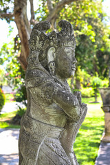 Balinese statue in the middle of a garden, Bali, Indonesia