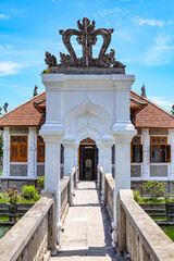 Bridge to a palace over an artificial lake, Bali, Indonesia