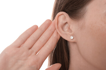 Woman showing hand to ear gesture on white background, closeup