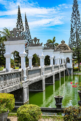 Bridge to a palace over an artificial lake, Bali, Indonesia