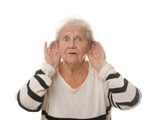 Senior woman showing hand to ear gesture on white background