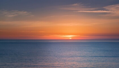 the horizon is painted with soft pastels as the sun sets casting a peaceful glow