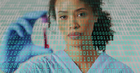 Scientist holding test tube with binary coding over laboratory image