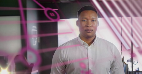 Image of financial data processing with globe over biracial businessman