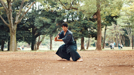 Man, fitness and sword in nature for martial arts, demonstration and training tradition in Kyoto....