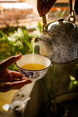 Pouring tea in a cup, Tea in cup, Pouring tea into a cup, Peshawari Kehwa, Peshawar Tea, Green Tea, Kehwa, Kawa, Peshawar special kehwa, Peshawar culture, Pathan culture, People of peshawar