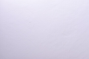 Close-up of a white textured wall, showing subtle patterns and imperfections, ideal for design,...