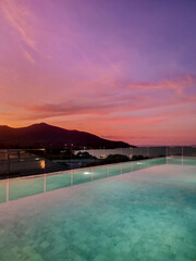 Fototapeta premium Serene sunset reflection over tranquil waters in Thailand