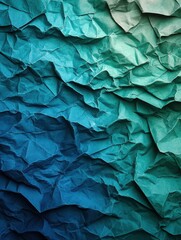 Fototapeta premium Gradient of cool-toned crumpled papers transitioning from blue to green for an artistic background