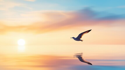Fototapeta premium A single bird silhouette gliding over calm ocean waters at twilight.