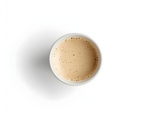 Overhead view of a cup of coffee. The light beige liquid, topped with a layer of foam, fills the cup almost to the brim, offering a warm and inviting feel.