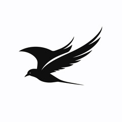 Obraz premium Elegant black silhouette of a bird in flight with detailed wings
