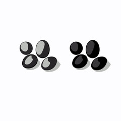 Close-up view of black stones arranged in two groups on a white background