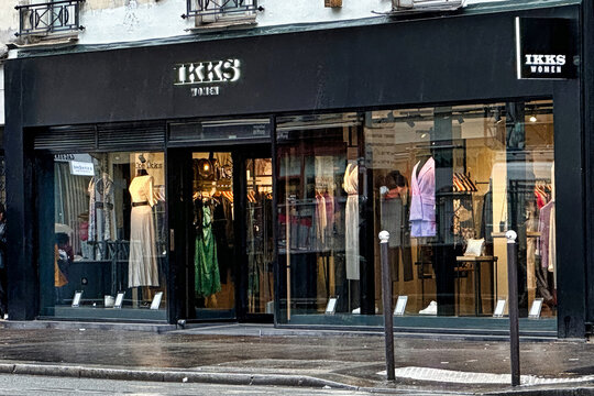 Paris, France - April 11 2023: IKKS sign is hanging above the entrance of a parisian clothing store
