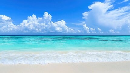 Obraz premium Tranquil Tropical Beach Scene with Clear Turquoise Water and Fluffy White Clouds Under a Bright Blue Sky in a Serene Coastal Landscape