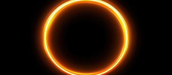 Naklejka premium A glowing orange circle resembling a solar eclipse or ring of fire.