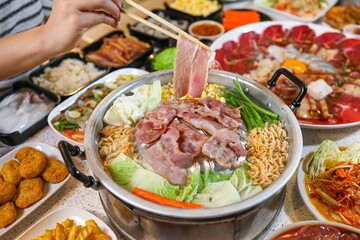 Obraz premium Delicious Hot Pot Meal with Fresh Ingredients