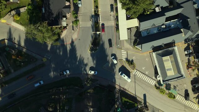 Scenic aerial view of Villa La Angostura's main urban area featuring Arrayanes Avenue. Nestled in Patagonia, Argentina, the image captures the charming blend of urban development and surrounding.