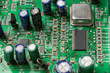 Close-up of a circuit board with microcircuits from an electrical appliance or computer. Selective...