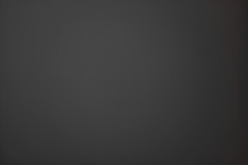 Gray horizontal background with concrete wall effect, copy space for text or image, with gradient darkening to the right side. Blank backdrop with the imitation of rough hard texture, painted metal.