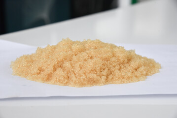 Microbeads of ion-exchange resin (ion-exchange polymer) Wet resin filtration for water purification on white background