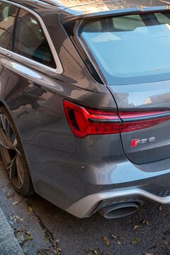 Rear of parked audi rs6 avant showing taillight and exhaust pipe