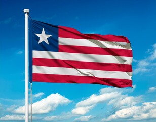 Liberian flag waving in the wind against a blue sky background