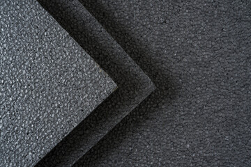 Top view of grey thermal insulation styrofoam sheets stacked on top of each other