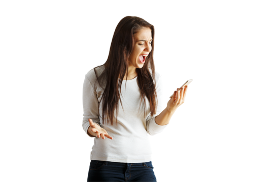 Woman in casual clothing holding a smartphone, expressing frustration with her open mouth and hand gesture, isolated on white background