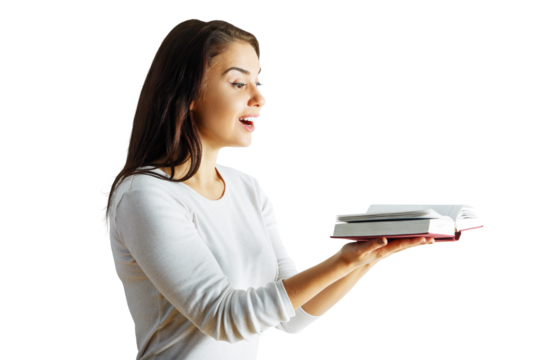 Woman holding an open book, wearing a white top, isolated on a clean white background. Concept of reading, learning, and education
