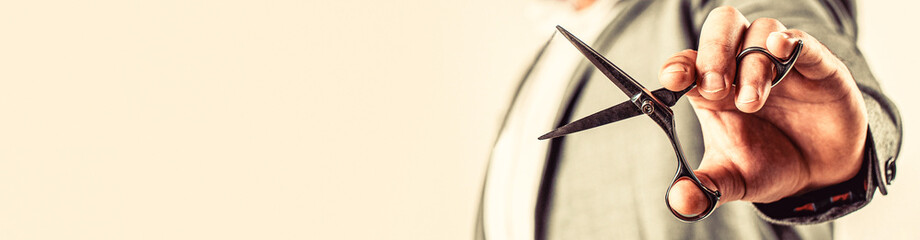 Barber shop. Man holding scissors. Barber scissors, barbershop. Barber scissors vintage barbershop