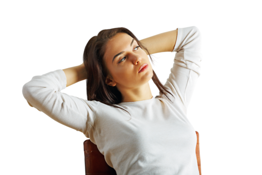 Young woman in white shirt leaning back with relaxed posture, isolated on white background, concept of calmness and confidence