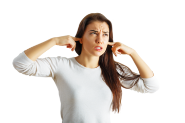 Woman with long hair and white shirt plugs her ears in frustration, isolated on a white background. Concept of ignoring or avoiding noise or annoyance