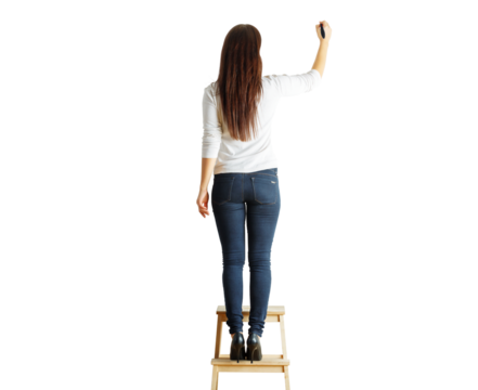 Back view of a woman standing on a wooden ladder holding a marker in one hand, wearing casual outfit, isolated on a white background, concept of writing or teaching