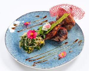 Fried Chicken with Greens on a Plate Against a White Background