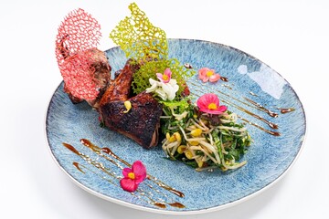 Fried Chicken with Greens on a Plate Against a White Background
