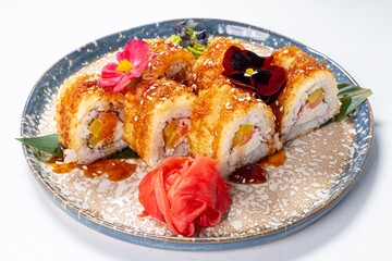 Yellow Japanese Rolls Decorated with Flowers on a White Background
