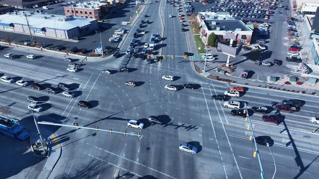 Aerial highway intersection traffic Orem Utah. Orem has a wide variety of stores and businesses. Malls, stores, residential neighborhoods, parks and churches.