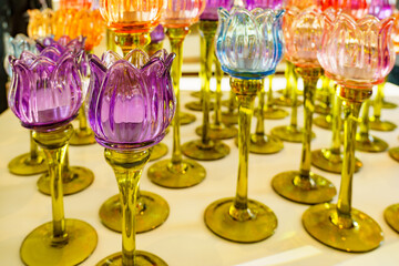 Decorative glass lanterns in tulip shape in the colors blue, orange, pink, red and purple