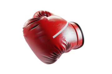 Red boxing glove resting on a surface, showcasing a classic design and vibrant color for training and competition