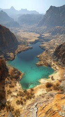 Obraz premium A breathtaking aerial view of a tranquil turquoise lake surrounded by rugged mountains and dry desert landscape.