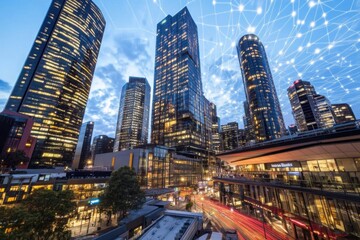 Obraz premium Futuristic cityscape at dusk with illuminated skyscrapers and digital connections