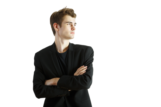 Young man wearing ablazer with arms crossed, looking confidently to the side. Isolated on a white background. Concept of professional attitude