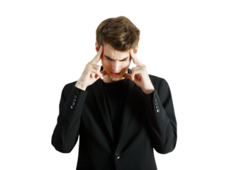 Young man wearing asuit and focusing with fingers on his temples in a close-up view, isolated on a white background, concept of concentration