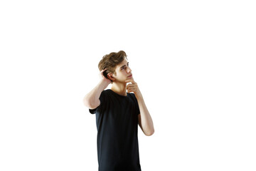 Young man in casualshirt thinking and scratching head, isolated on white background. Concept of decision-making and curiosity