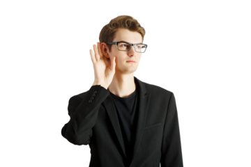 Man in a suit and glasses holding hand to his ear, posing on white background, concept of listening, rumor or gathering information